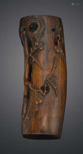 A carved hardwood wrist rest
