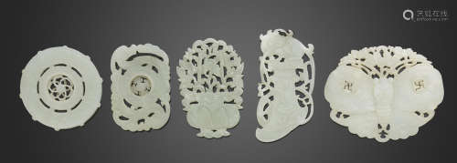 A group of five reticulated jade plaques
