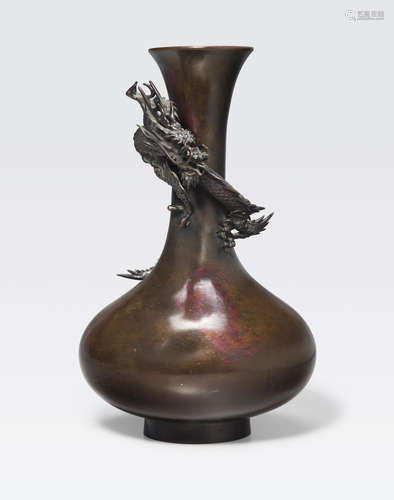 A patinated bronze vase decorated with a dragon Meiji era