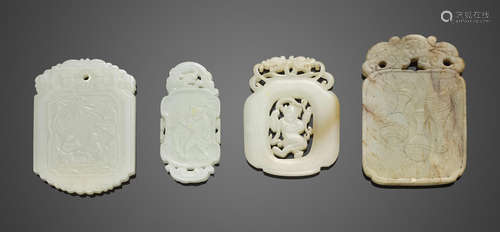 A group of four jade pendants