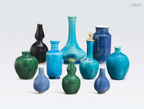 A group of twelve monochrome glazed miniature vases