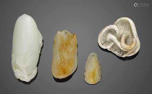 A group of four jade toggles of vegetal form
