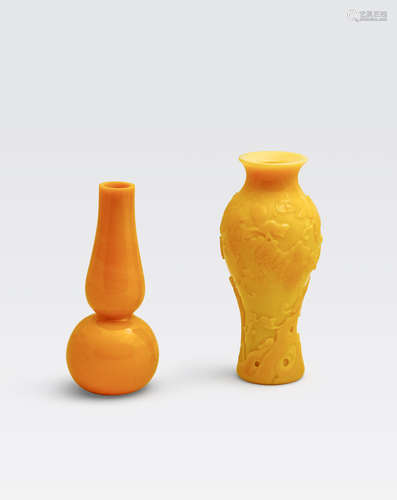 Two opaque yellow glass vases