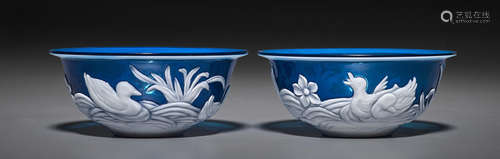 A pair of white-overlaid blue Peking glass bowls 20th century