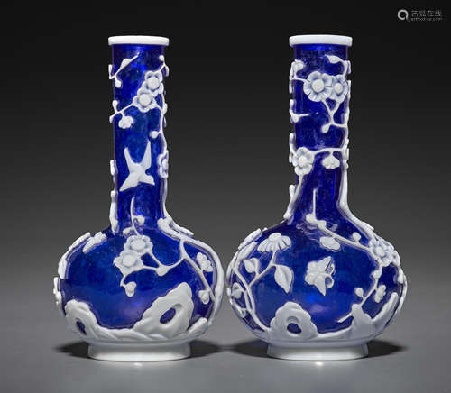 A pair of white-overlaid cobalt blue stick neck vases 20th century