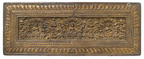 A gilt lacquered wood manuscript cover Tibet, 14th/15th century