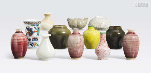 A group of miniature glazed containers