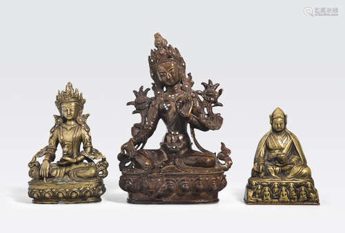 A group of three copper alloy figures