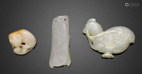 A group of three small white jade carvings