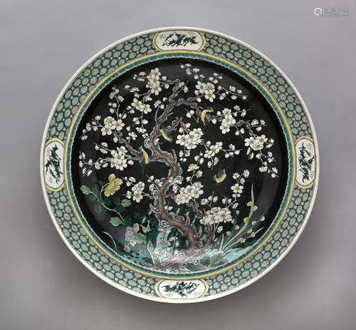 A large famille noire enameled charger Kangxi mark