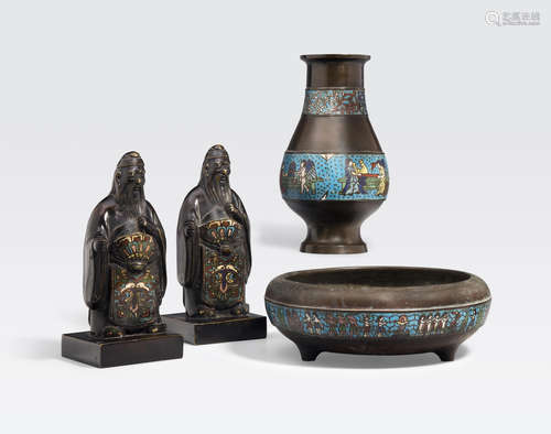 A group of four champlevé enameled metal decorations Republic period