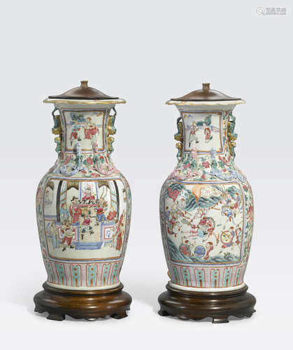 A pair of famille rose enameled vases with lion cub handles 19th century