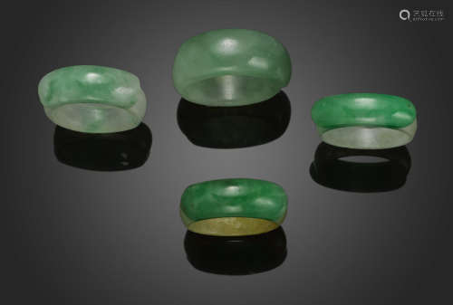 A group of four jadeite saddle rings