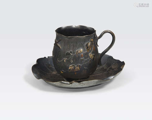 A mixed metal inlaid tea cup and saucer Meiji era