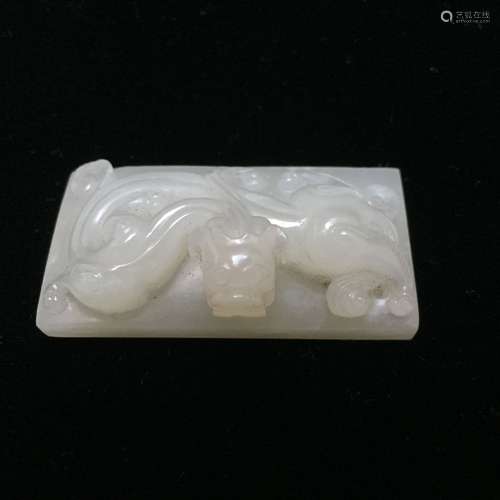 AN ANTIQUE WHITE JADE ‘CHILONG’ SEAL