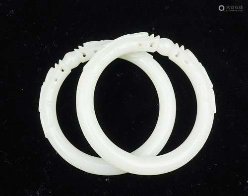 PAIR OF CHINESE WHITE JADE DRAGON BANGLES