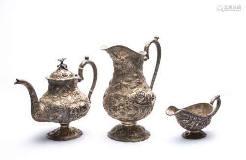 A Set of Three Pieces Sliver Teapot and Cups with Carved Flower