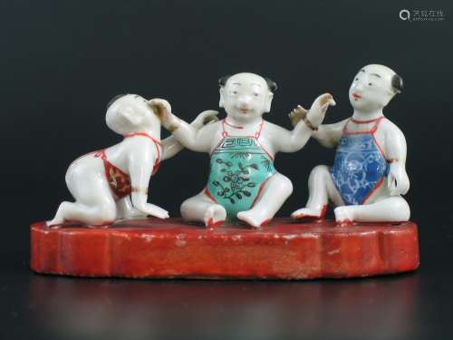 Chinese Famille Rose Porcelain Figurine of Three Boys, 18th Century.