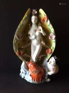 Antique porcelain beauty within a sea shell