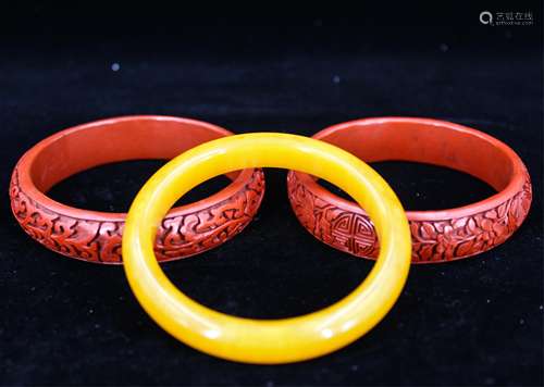 TWO CHINESE CINNABAR LACQUER BANGLE & AGATE BANGLE