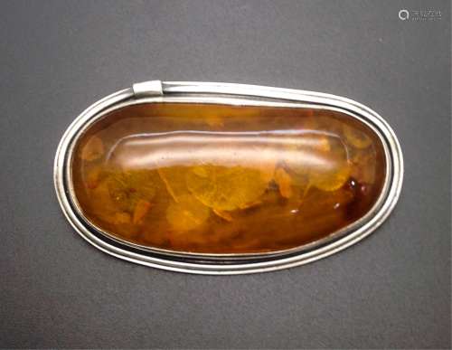 CHINESE AMBER ON SILVER BROOCH