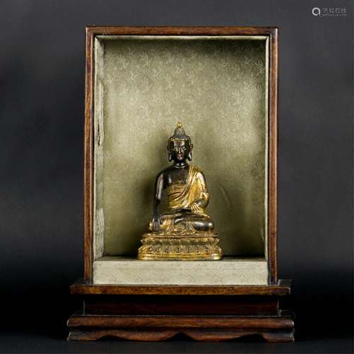 CHINESE GILT BRONZE FIGURE OF SHAKYAMUNI WITH HOUS