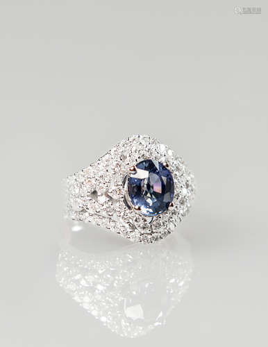 An Oval Shaped Sapphire Ring Mounted With Diamond