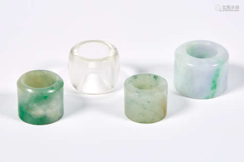 Group of Three Chinese Jadeite Archer's Rings; Together with a Chinese Rock Crystal Archer's Ring