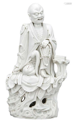 Chinese Blanc de Chine Figure of a Seated Luohan Early 19th century