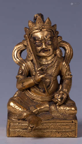 CHINESE GILT BRONZE FIGURE OF JAMBHALA