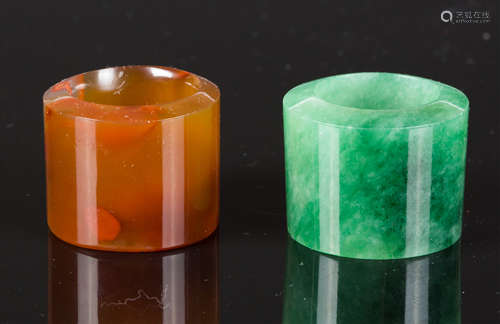 TWO CHINESE THUMB RINGS, JADEITE AND AGATE