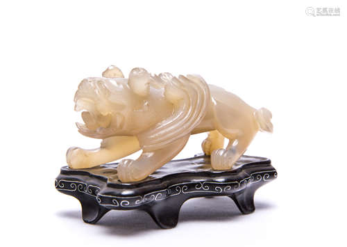 A Chinese Agate Dragon With Wood Stand