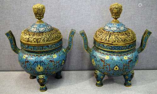 Pair of Cloisonné censers. China. Late 19th century. Decoration of archaic dragons and lotus scrolling on a turquoise ground. Gilt repousse mounts. 21