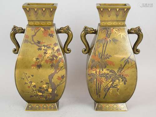 Pair of mixed metal vases. Japan. Meiji period (1868-1912). Squared pear shape with dragon handles. I. morning glory inlay of gold, silver, copper and shakudo. Decoration of pomegranate trees, wisteria, maples, morning glories and other flowers. Signed Nagawa. 7-3/4