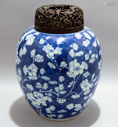 Porcelain jar. China. K'ang hsi period (1662-1722). Underglaze blue decoration of flowering prunes. Carved rosewood cover (loss to cover). 9-1/2