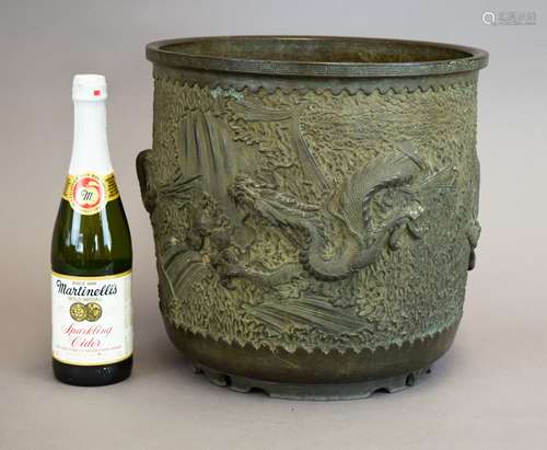 Bronze jardinières. Japan. Meiji period (1868-1912). Cylindrical with a design of dragons and waves. 14