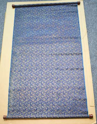 Chinese 18th/19th century silk woven panel mounted as a scroll. Blue ground with gilt thread depciting dragons in round medallions and clouds. Two sided. 50