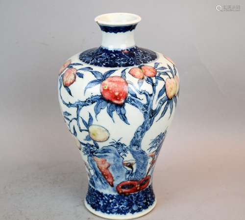 Porcelain vase. China. 19th century. Underglaze blue and red decoration of peach tree and Ling Chih. Floral scroll borders. Yung Cheng mark on the base. 9-1/2