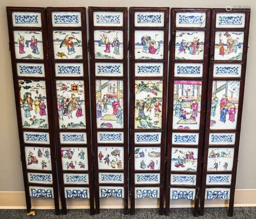 Six panel screen. China. Underglaze blue decoration. Famille Rose historical scenes set in a rosewood frame. 40