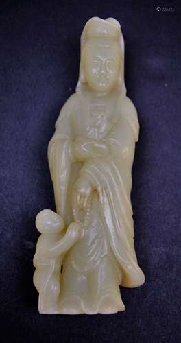 Jade carving. China. 20th century. Celadon coloured stone, Kuan Yin with a shield. 5-1/2