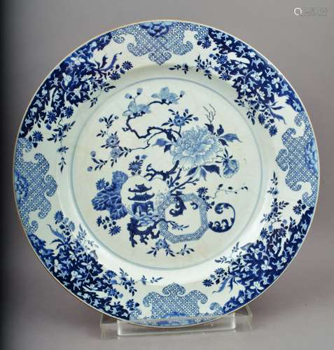 Porcelain charger. Chinese Export ware. 18th century. Underglaze decoration of flowers and brocade patterns. 17