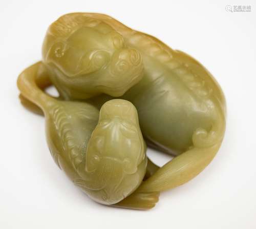 Jade carving. China. 20th century. Grey and brown stone. Mythical animal and its cub. 4