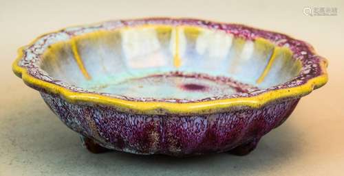 Chun Yao bulb bowl. China. Possibly 19th century. Turquoise glaze infused with purple. Foliated edge. Lobated body, tripod base. Marked San (3) on the base. 9