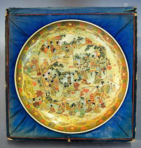 Pottery plate. Japan. Meiji period (1868-1912). Vignettes of Rakans, Historical scenes in shaped medallions on a brocade ground. Signed. 12