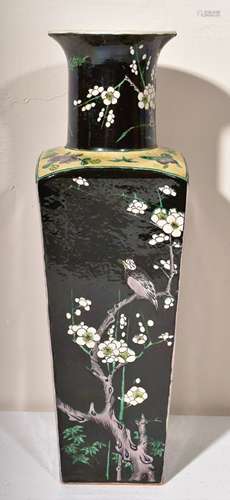 Famille Noir vase. China. 19th century. Square form with a trumpet mouth. Decoration of birds, butterflies and flowering trees. Drilled to be mounted as a lamp. 14