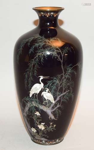 Cloisonné vase. Japan. Meiji period. (1868-1912). Silver wire work design of a pair of egrets in a willow tree on a midnight blue ground. 7-1/2