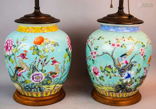 Pair of porcelain jars. China. Early 20th century. Ovoid form. Turquoise ground with Famille Rose decoration of birds and flowers. Drilled and mounted as lamps. Jars- 9