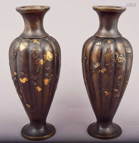 Pair of bronze vases with mixed metal inlay. Japan. Meiji period (1868-1912). Lobated body. Decoration of cucumber vines and butterflies. Signed Nagawa. 9-1/2