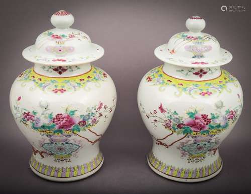 Pair of Famille Rose baluster jars with covers.