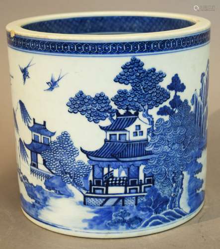 Porcelain wine cooler. Chinese Export ware. Circa 1800. Cylindrical form. Nanking style. Underglaze blue decoration of pavilions in a landscape. (rim chip). 7